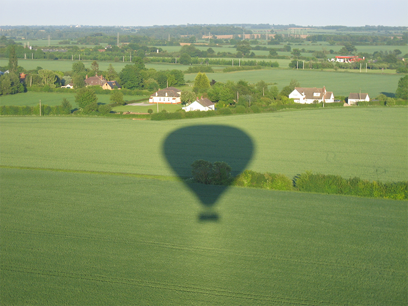 Taking pictures of the balloon shadow and the aerial view is popular on Essex Balloon Flights and Rides