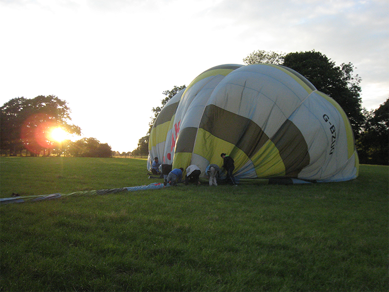 After the Essex balloon flight landing comes the fun of packing the balloon away in its bag