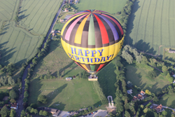 Looking down on our Happy Birthday balloon and an aerial picture of Essex by balloon